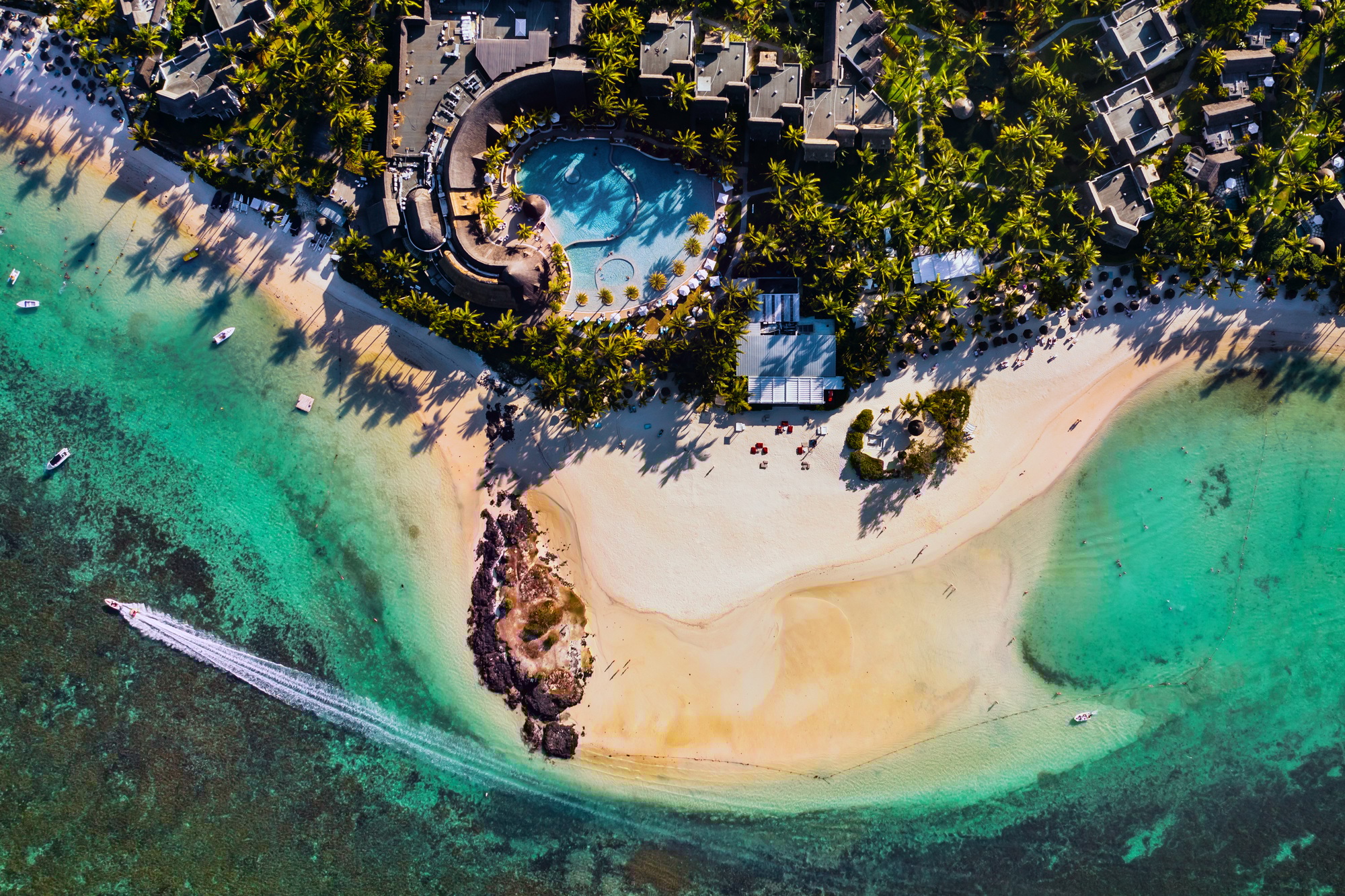 Aerial picture of the east coast of Mauritius Island. Flying above the turquoise lagoon of Mauritius