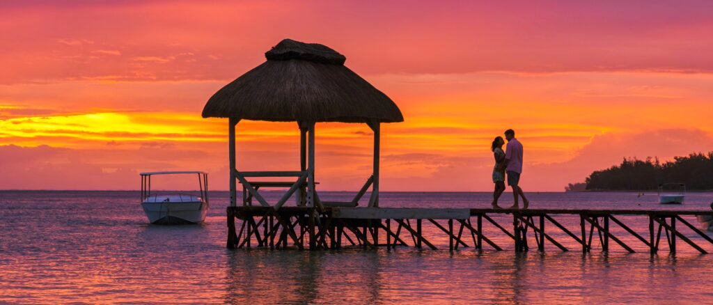 Man and Woman on a tropical beach in Mauritius, a couple on honeymoon vacation in Mauritius